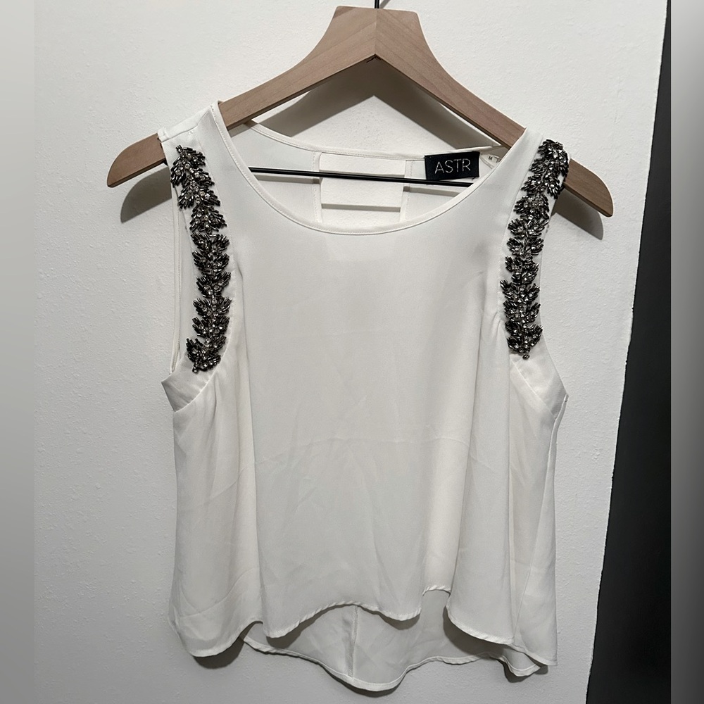 White ASTR tank with sequined accents.